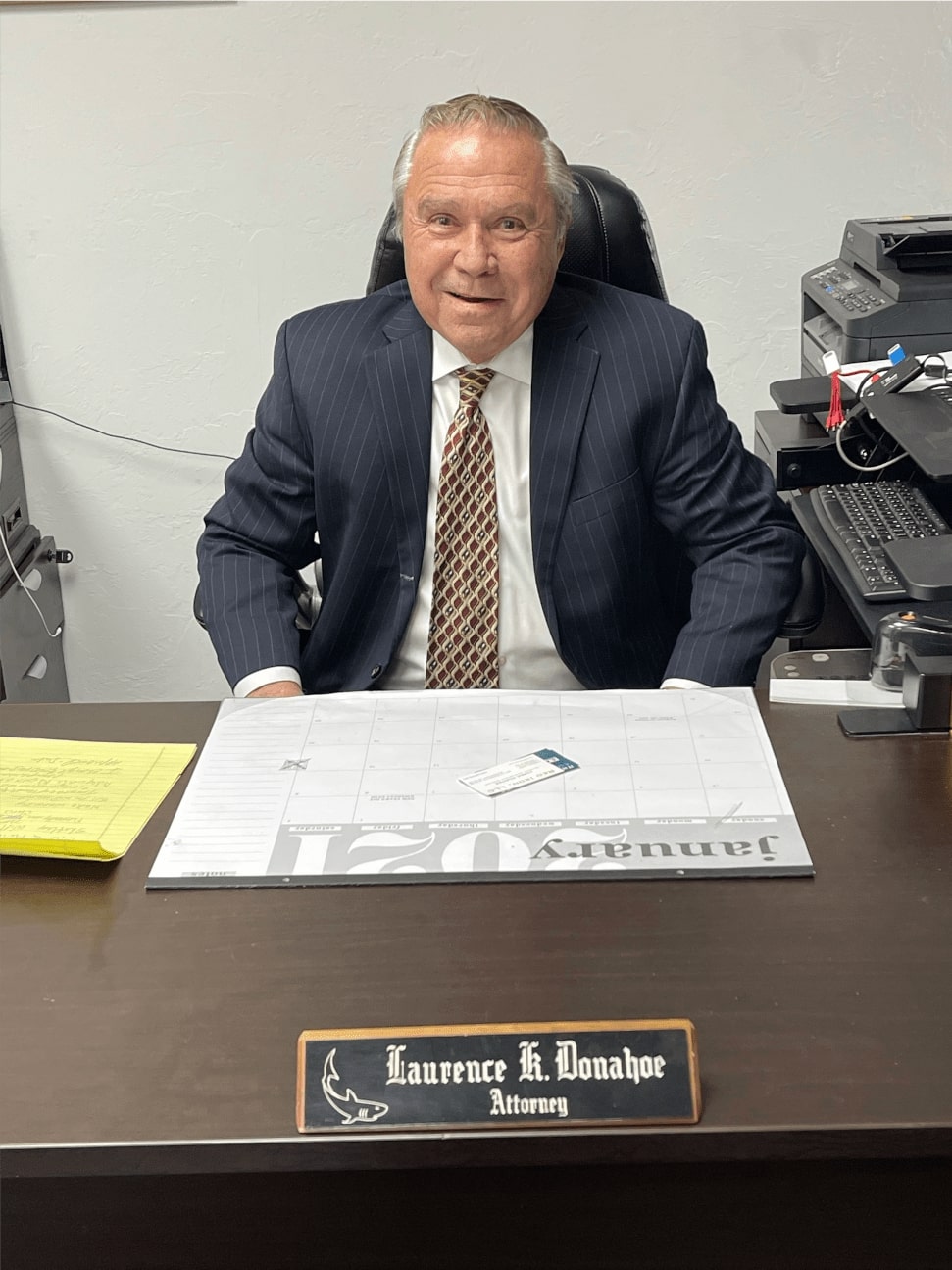 Laurence K. Donahoe sitting at his desk from LKDLAW PC